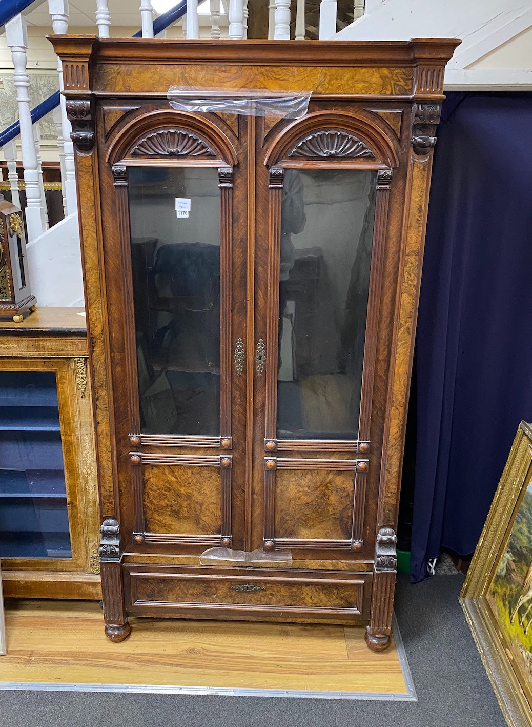 A 19th century French figured walnut glazed two door cabinet, width 101cm, depth 46cm, height 185cm